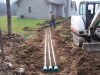 Drainage lines have been installed to remedy a severe water problem around a foundation.